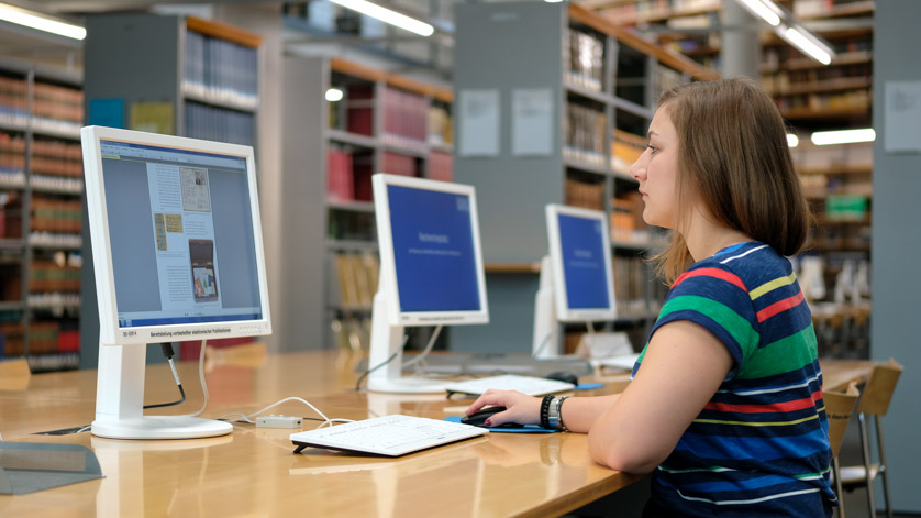 A user reading an online publication at one of our reading room PCs