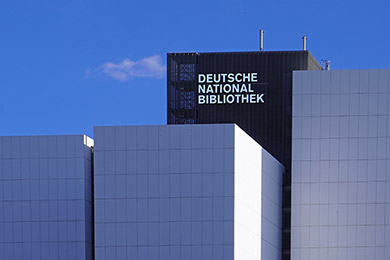 Detail of the white book towers with the DNB’s logo on the core segment