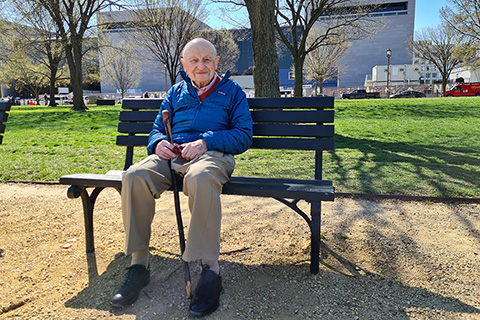 Kurt S. Maier sitting on a park bench