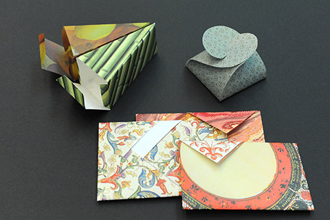 Writing paper, envelopes, folded boxes made of paper in various patterns and colours