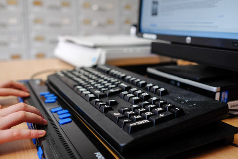 The technical equipment at our workstation for blind and visually impaired users: keyboard with extra-large engraved letters and characters. Braille output device