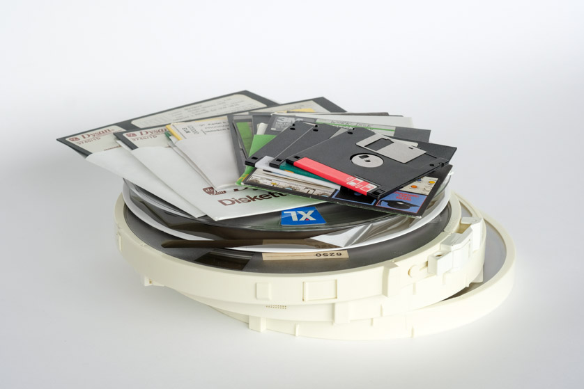 Magnetic tapes, floppy disks in various sizes and optical data carriers in a pile