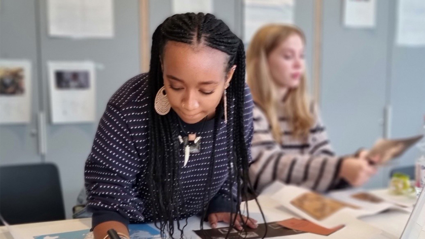 Two schoolgirls at a workshop. Two schoolgirls at a workshop.