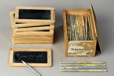 Slates and a selection of slate pencils Slates and a selection of slate pencils