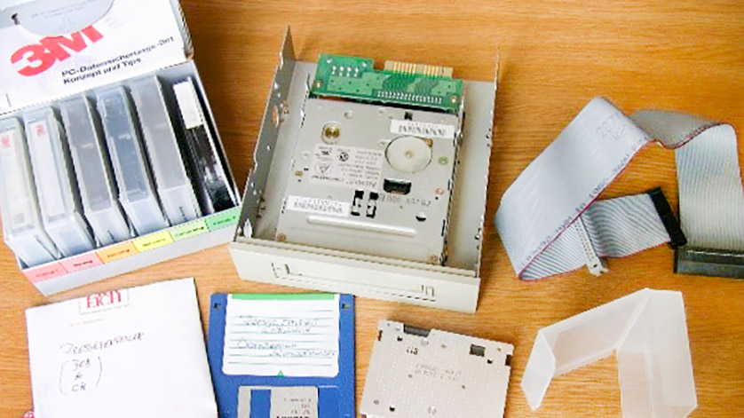 Various digital storage media, including cassettes, magnetic tapes and diskettes, shown lying on a table Various digital storage media, including cassettes, magnetic tapes and diskettes, shown lying on a table