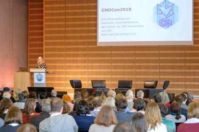 Opening event at GNDCon, the Integrated Authority File Convention held in 2018; Dr. Elisabeth Niggemann greets participants