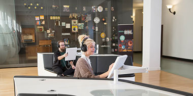 A woman and a man use the listening stations in the exhibition area of the German Music Archive A woman and a man use the listening stations in the exhibition area of the German Music Archive